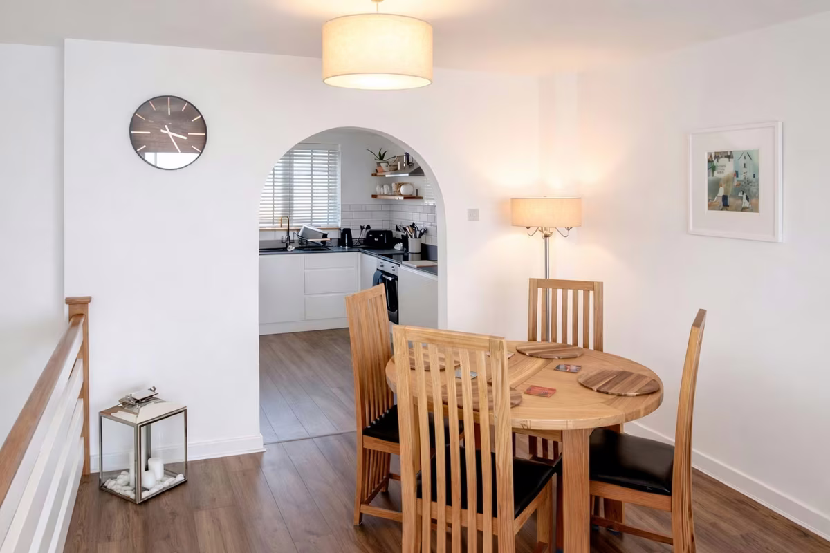 Venedotia – open-plan dining area with arched kitchen through